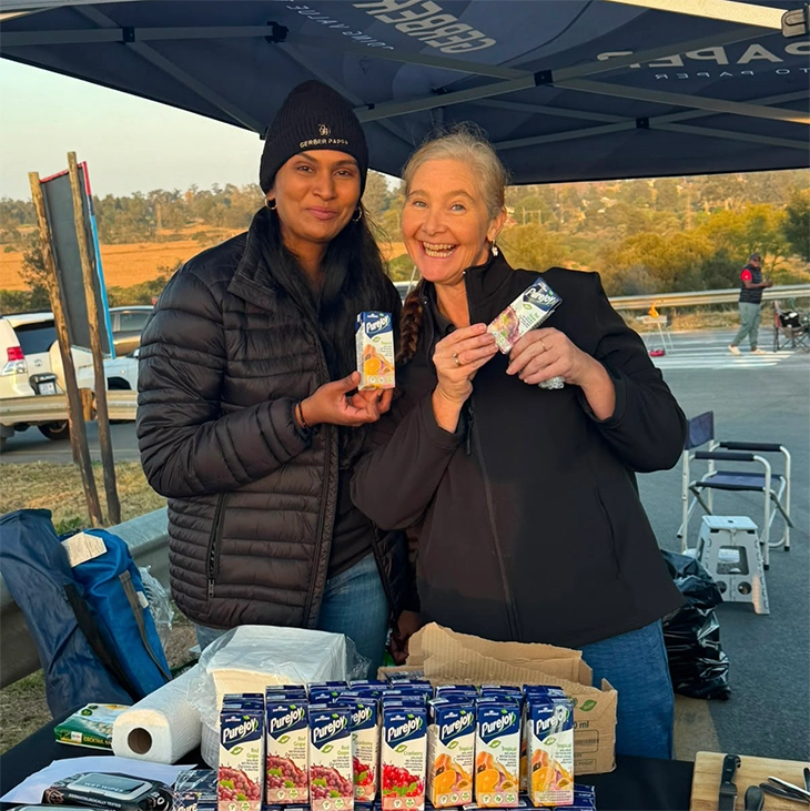 Gerber Paper volunteers preparing refreshments for Comrades Marathon runners