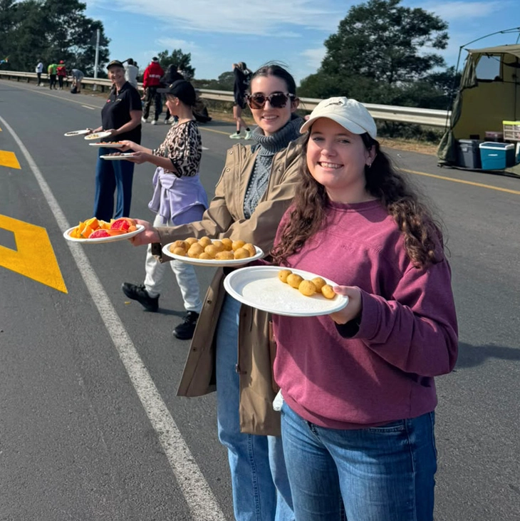 Gerber Paper employees offering refreshments to runners at the Comrades Marathon