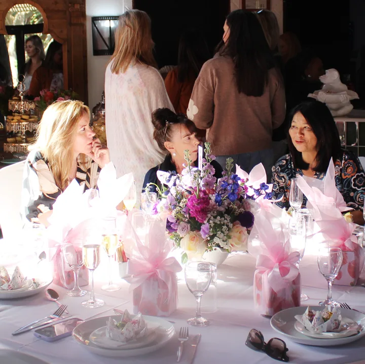 Guests enjoying the table setting and refreshments at the Gerber Paper Ladies’ Tea.