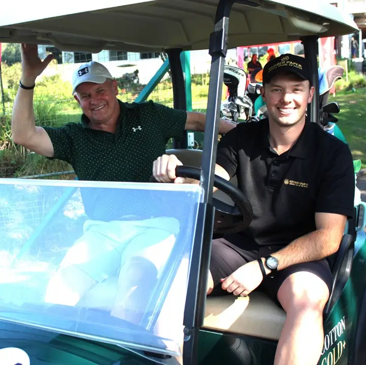 Players driving a golf cart during the 2026 Gerber Paper Durban Golf Day.