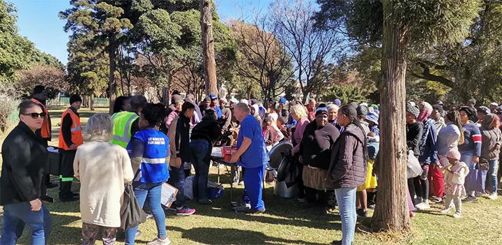 Gerber Paper distributing handouts for Mandela Day