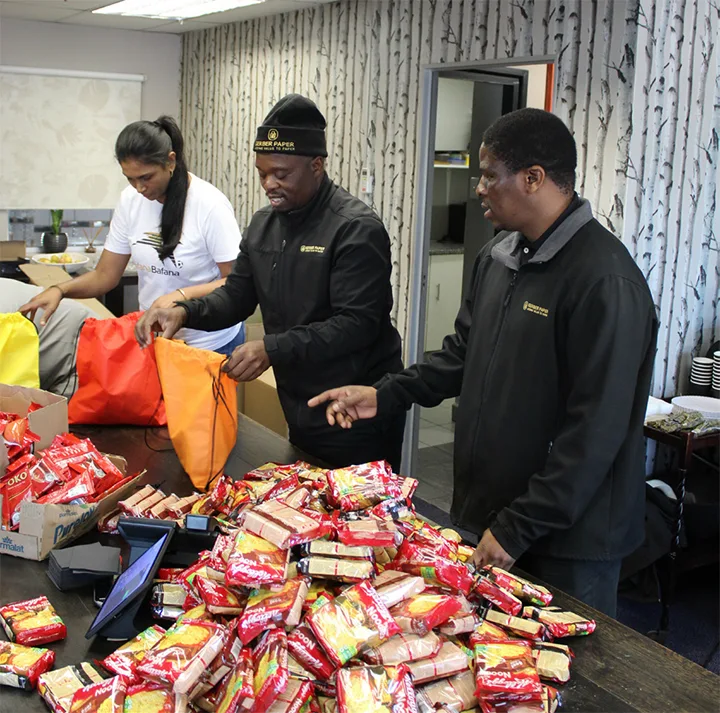 Gerber Paper Durban team preparing goodie bags for Golden Steps School for their Mandela Day initiative