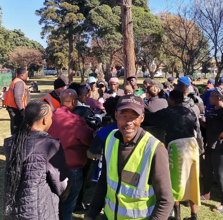 The Germiston community receiving hot dogs from the Gerber Paper Johannesburg team for Mandela Da