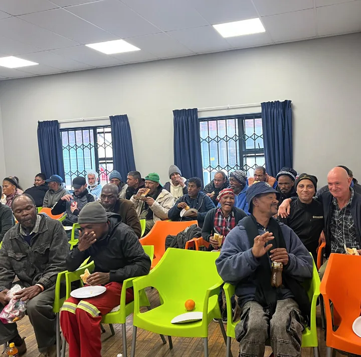 Community members at Centre of Hope in Cape Town enjoying hot dogs for Mandela Day